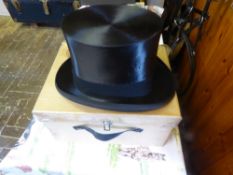 Black silk top hat by Lock & Co., size approx. 58 7/1/8, comes with cardboard hat box