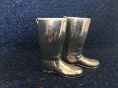 Posy vases in the form of a pair of silver plated riding boots with ceramic linings, 3ins high