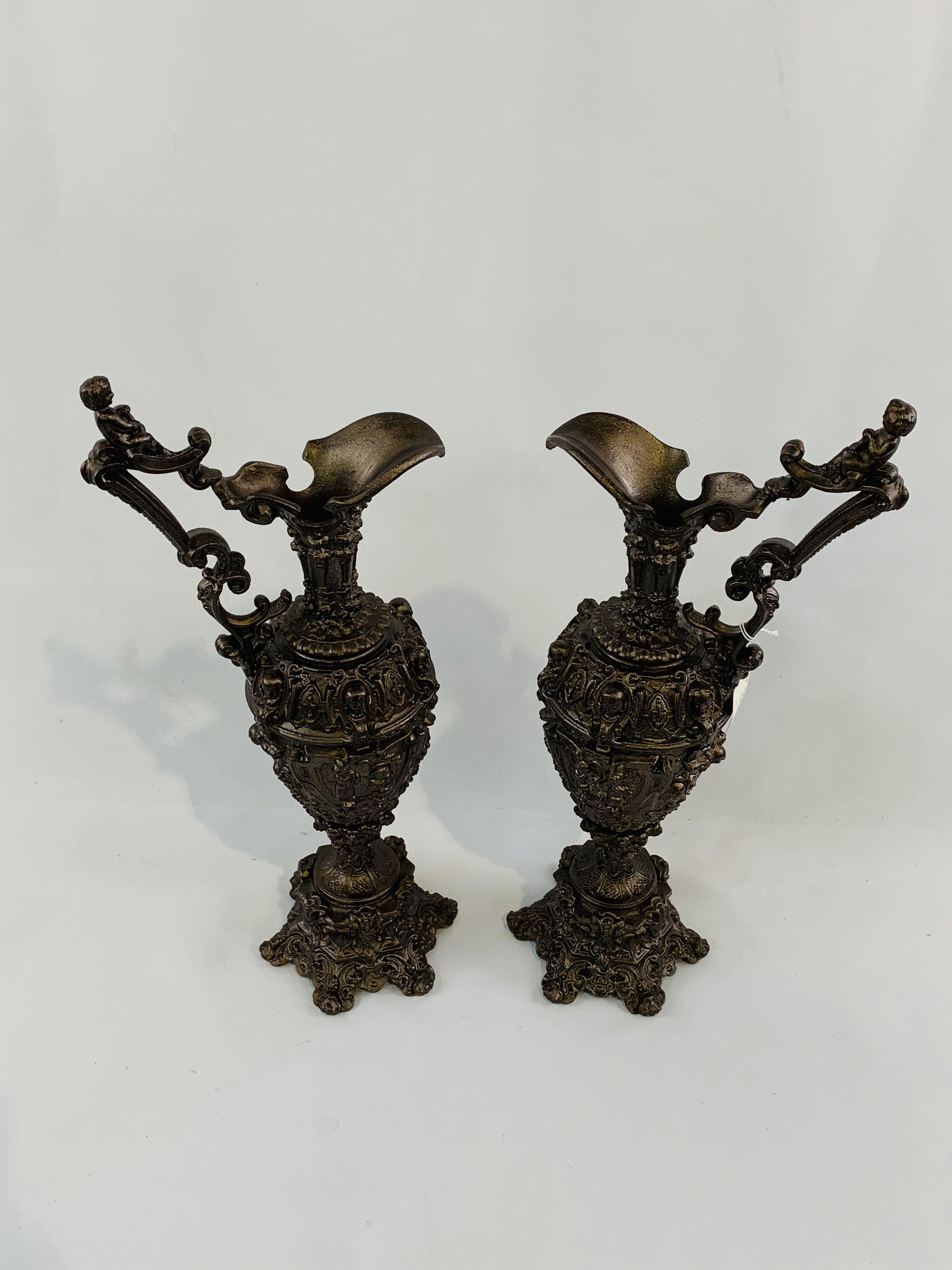 Pair of large Grecian ewers, bronzed and ornately cast with cherub handles. - Image 3 of 3