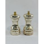 Hallmarked silver matching salt and pepper mills.