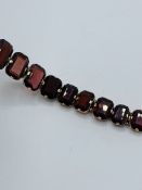 Gold-plated garnet bracelet.