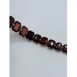 Gold-plated garnet bracelet.