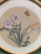 Three circular framed and glazed Chinese paintings on silk of flowers with butterflies and birds.