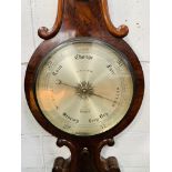 Flame mahogany case of banjo form barometer and thermometer by James How.