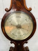 Flame mahogany case of banjo form barometer and thermometer by James How.