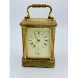 Small brass case carriage clock by Henry Marc, Paris.