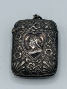 Silver vesta case, silver shield shaped pendant and 9ct cross prendant