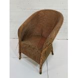 An original Lloyd Loom armchair by W Lusty and Sons Ltd