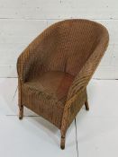 An original Lloyd Loom armchair by W Lusty and Sons Ltd