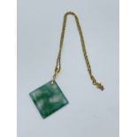 Square cut pendant of moss agate with gold bale and 9ct gold chain.