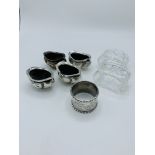 4 hallmarked silver cruet pots; a silver napkin ring and 2 Waterford glass napkin rings