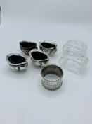 4 hallmarked silver cruet pots; a silver napkin ring and 2 Waterford glass napkin rings
