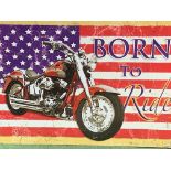 ‘Born to Ride’ large US flag as a Harley Davidson motorbike advertising sign.