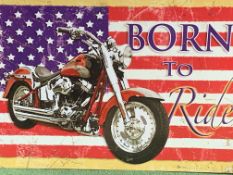 ‘Born to Ride’ large US flag as a Harley Davidson motorbike advertising sign.