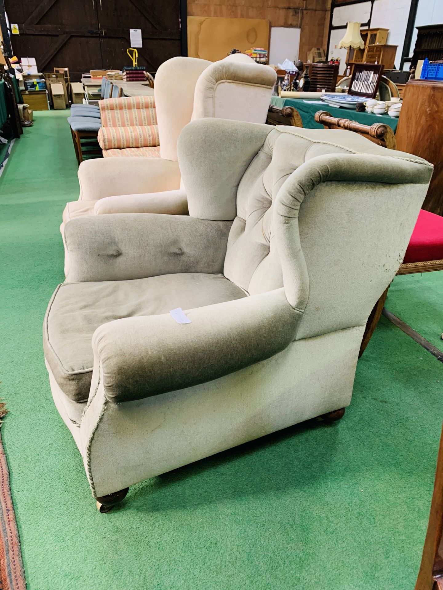 A large green upholstered Victorian armchair on casters. 100 x 100 x 88cms. - Bild 2 aus 2