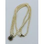 3 string cultured pearl necklace with 9ct gold, emerald and diamond clasp.