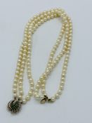 3 string cultured pearl necklace with 9ct gold, emerald and diamond clasp.