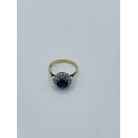 Diamond and sapphire daisy cluster ring in 9ct gold.
