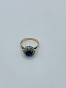 Diamond and sapphire daisy cluster ring in 9ct gold.