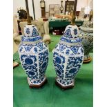 Pair of blue and white ceramic, height adjustable, two bulb table lamps.