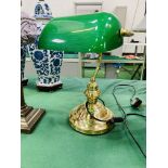 Two Brass desk lamps with green shades.