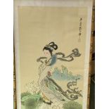 Bamboo framed and glazed Japanese painting on silk of a young lady in a garden, 68 x 33cms.