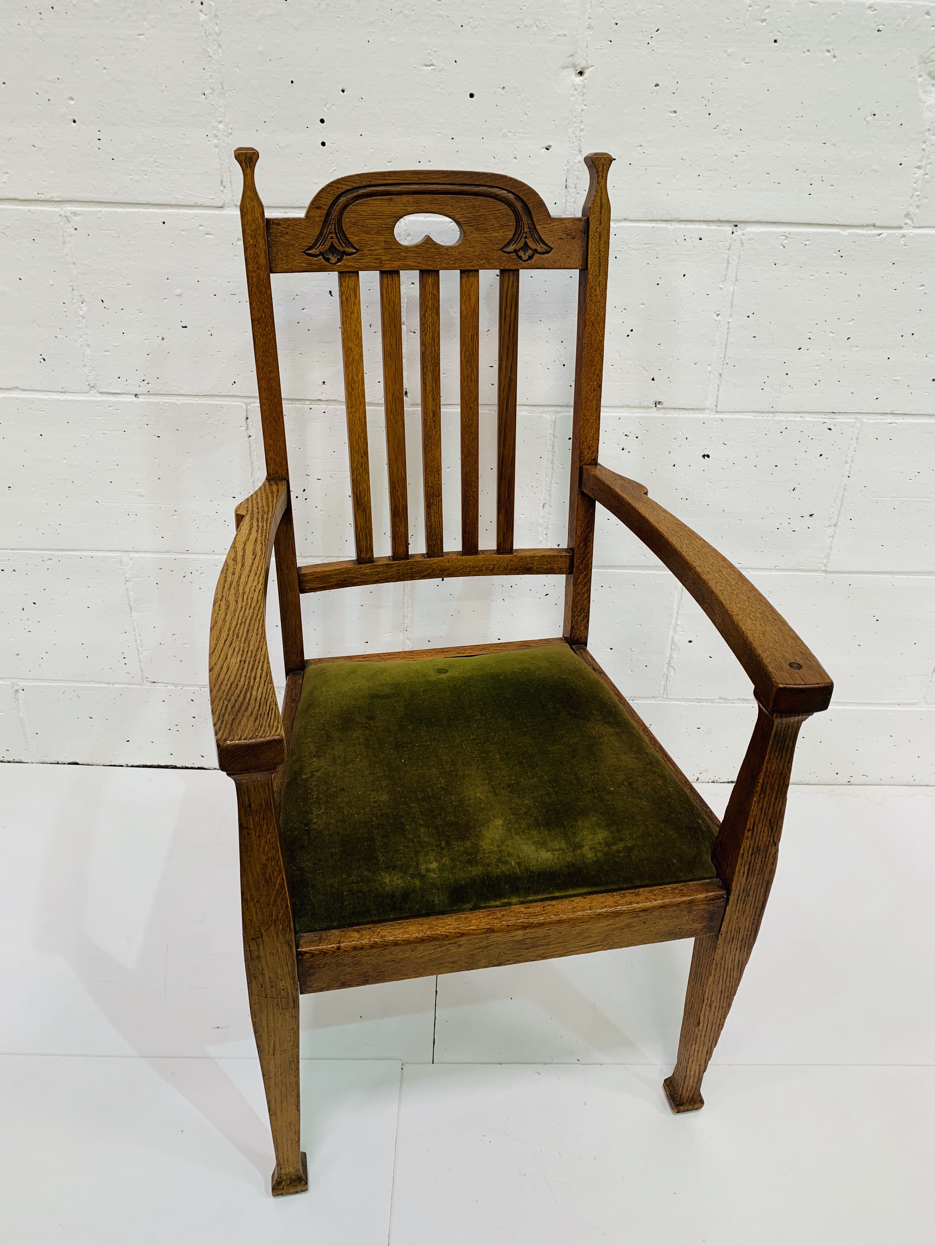 Arts and Crafts oak open armchair.