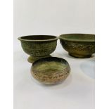 Five Middle Eastern decorative metal bowls.