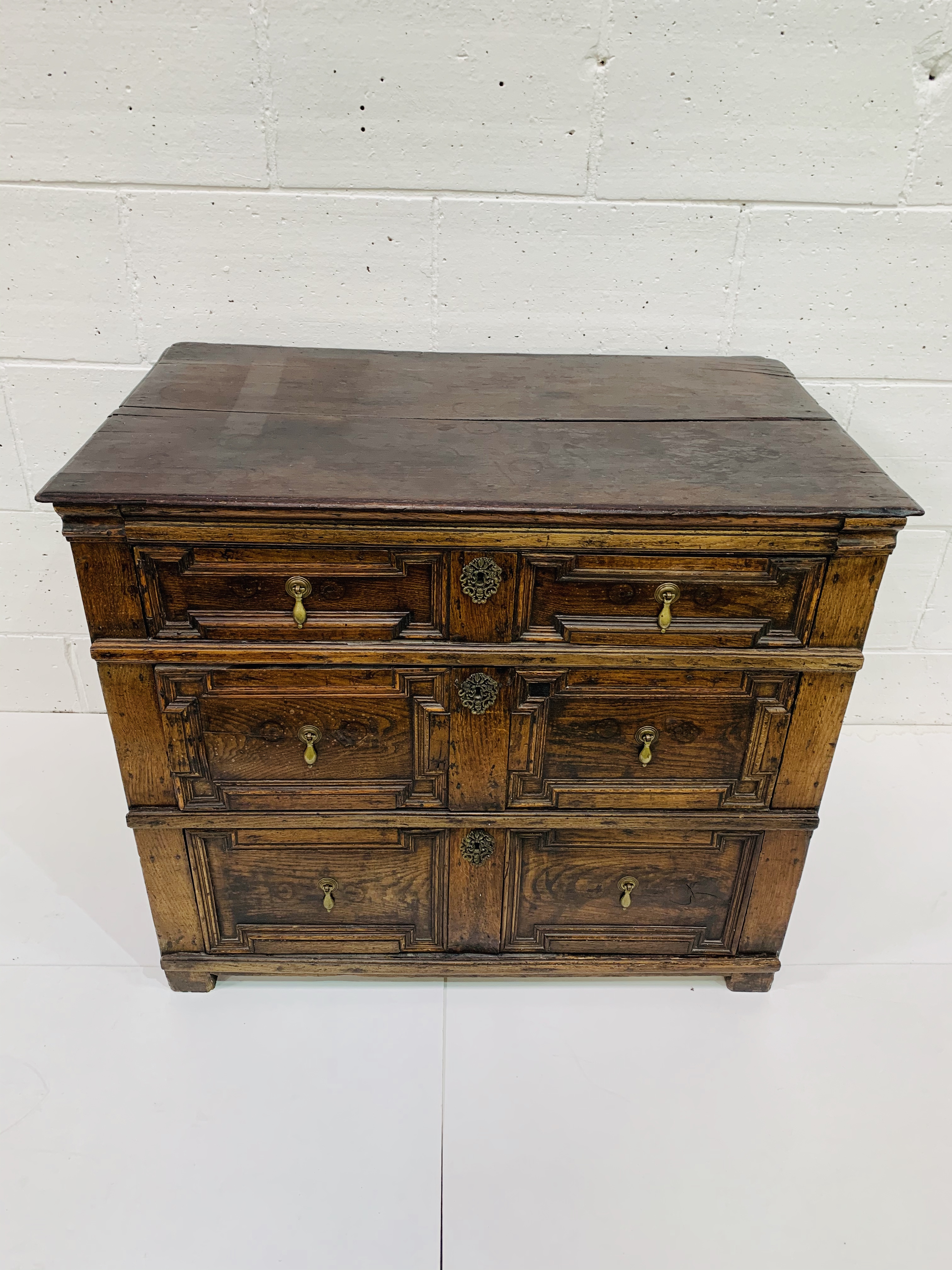 17th Century oak Jacobean style chest of three drawers with geometric moulded fronts.