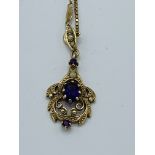 9ct gold chain with 9ct gold pendant set with amethysts and seed pearls, 7.7gms