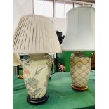 Two pairs of decorative ceramic table lamps.