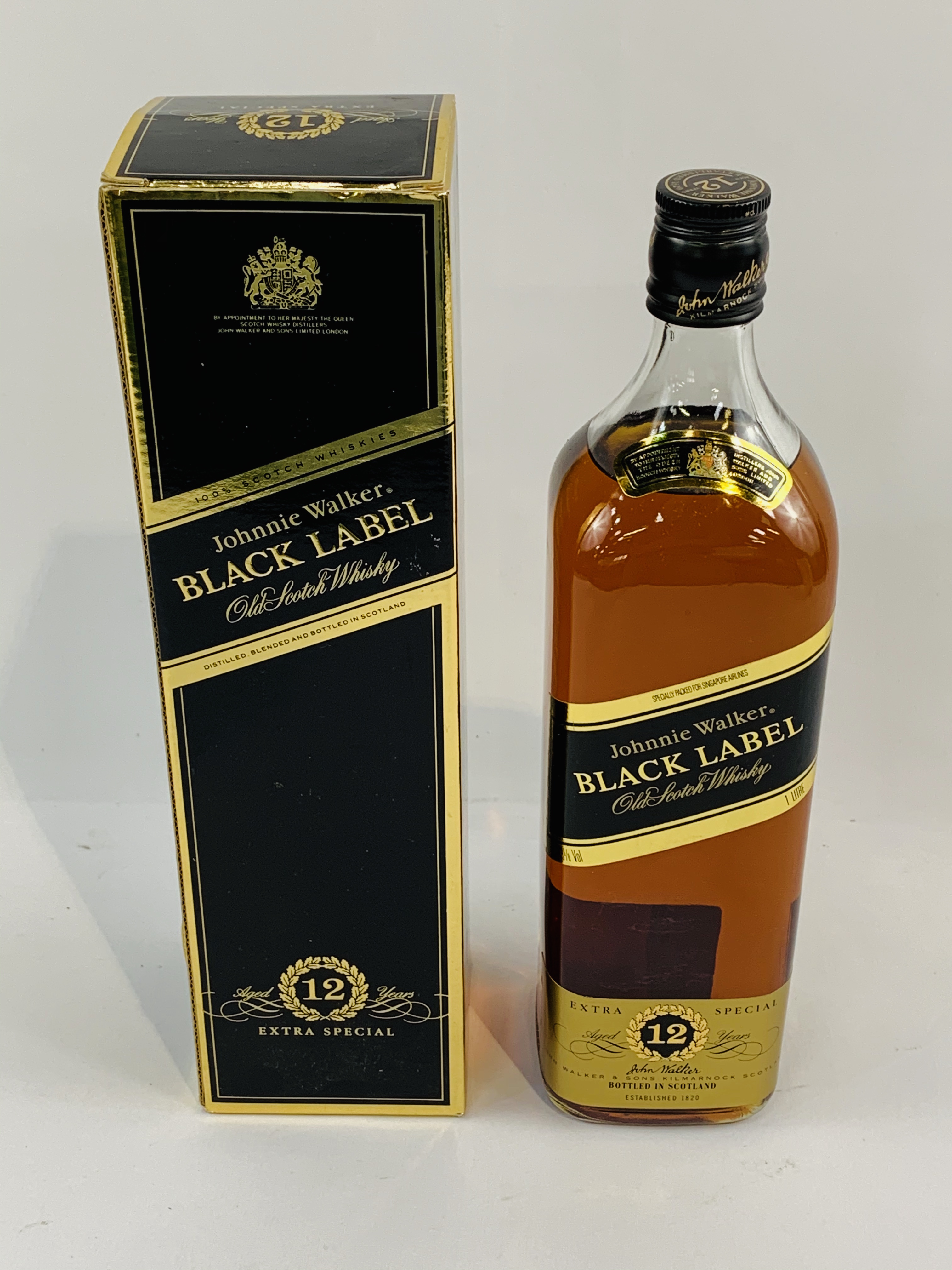 One litre bottle of Johnny Walker Black Label Whisky, new and in box.