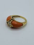 Coral and diamond ring with French marks.