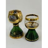 Two gold leaf hand painted musical glass goblets marked Wein and Reuge.