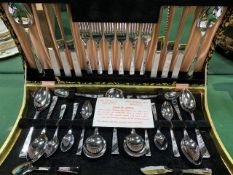 A boxed set of stainless steel cutlery