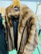 Brown fur three quarter length jacket and matching hat.