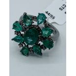 Emerald and diamond floral ring.