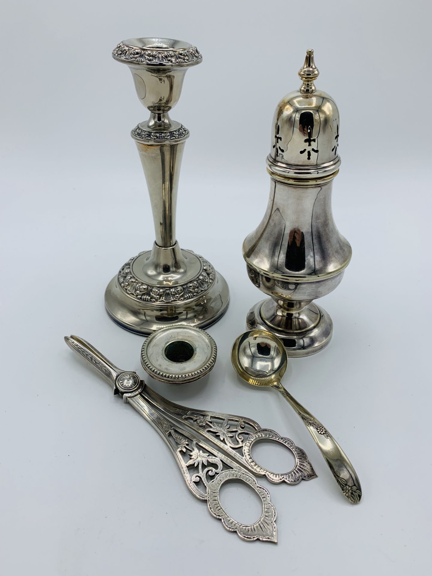Silver plated sugar caster; candle stick; snuffer and ladle
