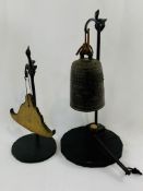 Bronzed metal temple bell on stand with hammer; together with a shaped brass gong on stand.