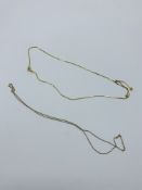 9k gold flat chain necklace, 2.4gms and 9ct gold very fine chain necklace, 0.8gms.