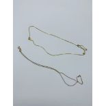 9k gold flat chain necklace, 2.4gms and 9ct gold very fine chain necklace, 0.8gms.