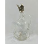 Swirled glass claret jug with star cut base and faceted neck.