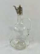 Swirled glass claret jug with star cut base and faceted neck.