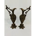 Pair of large Grecian ewers, bronzed and ornately cast with cherub handles.