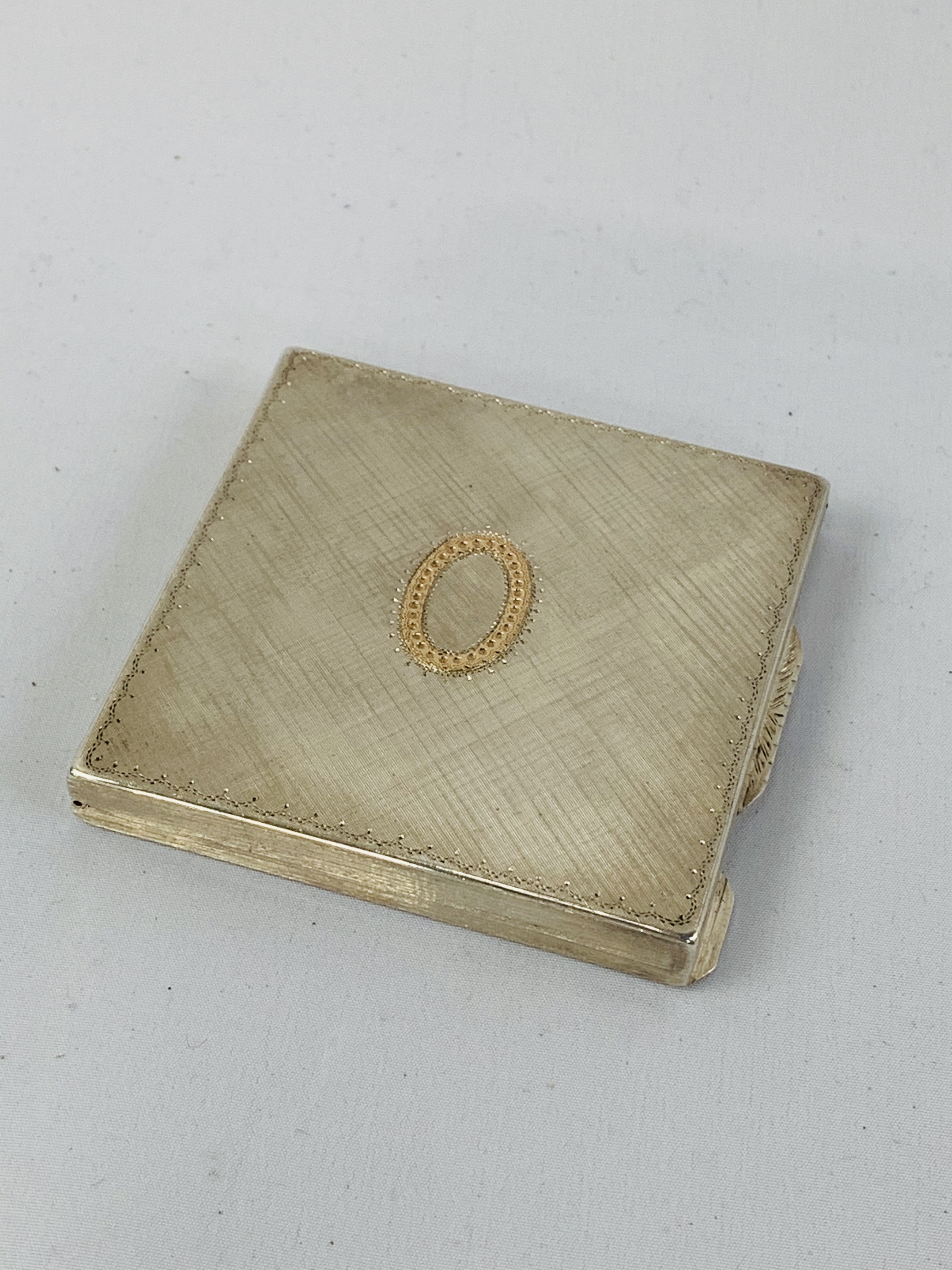 Italian 800 silver compact with 9ct gold central plaque 87gms.