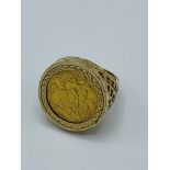 1909 half sovereign set in a 9ct gold ring, 11.0gms