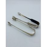 Georgian silver sugar tongs, London 1824, and a pair of silver plate sugar tongs.