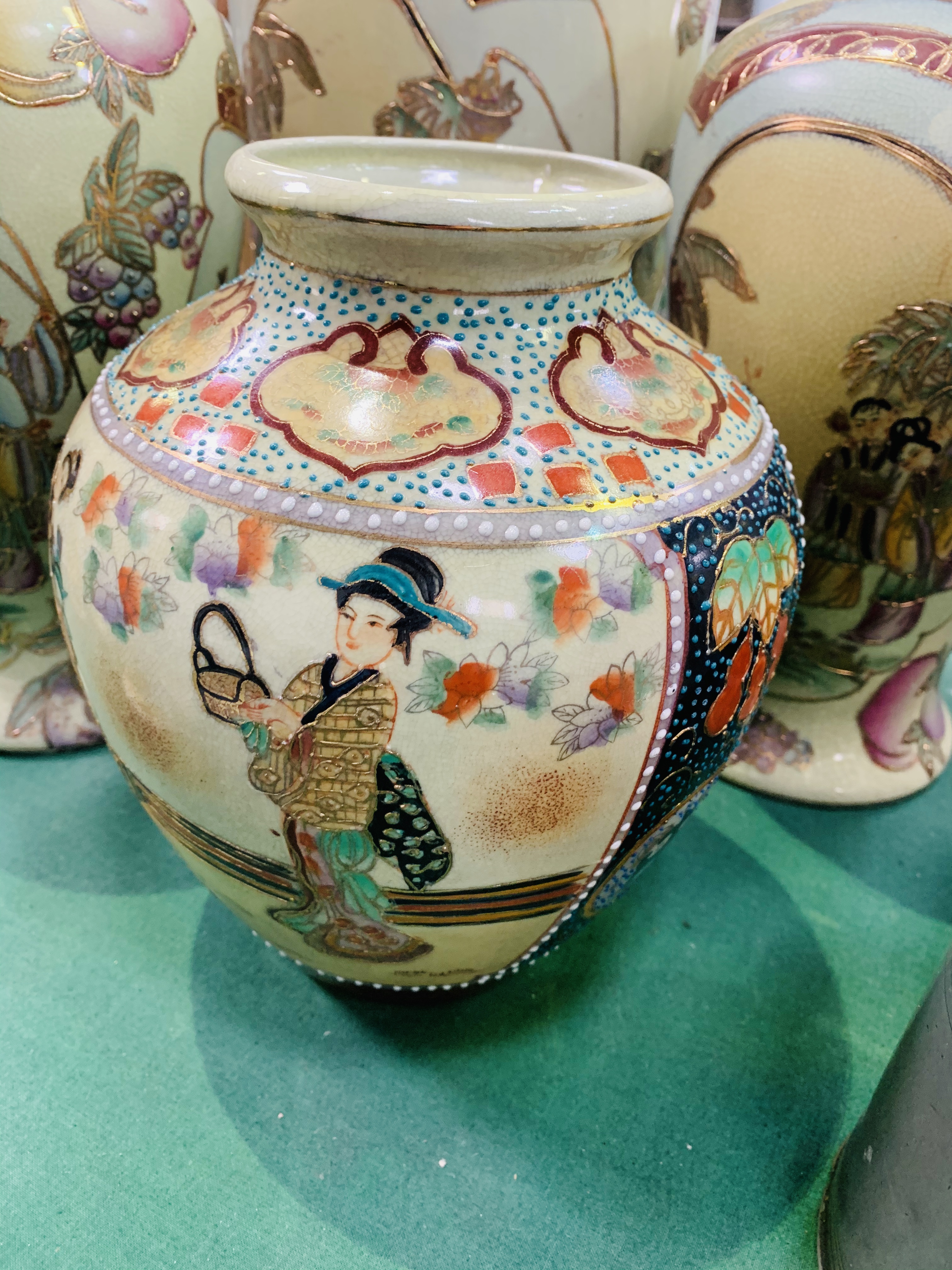 A pair and one other matching Oriental style vases, and another Oriental vase. - Image 3 of 3