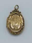 9ct back and front gold locket, 4.2gms
