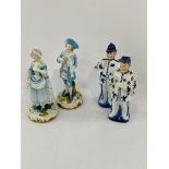 A pair of German porcelain figurines and another pair of porcelain figurines.